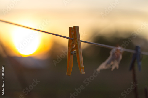 clothespin on the rope against the sunset