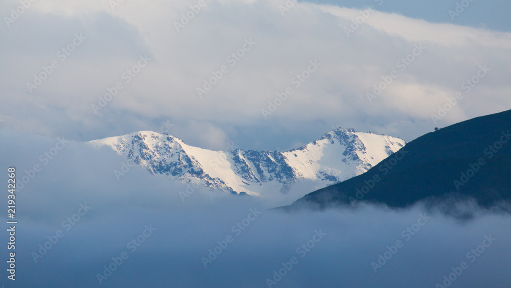 mountains from afar and clouds over the mountains