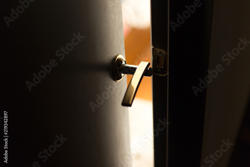 Half open door of a hotel bedroom or apartment