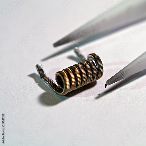 Clapton coil with ceramic tweezers photo