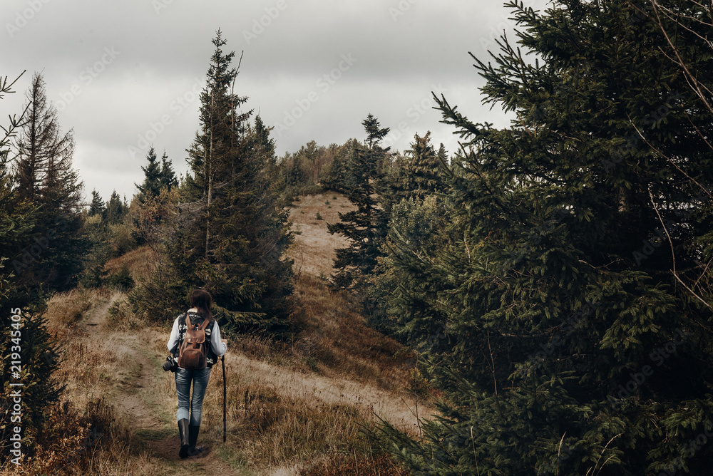 wanderlust and travel concept with space for text. hipster traveler on top of mountains, amazing view. stylish woman hiking. atmospheric moment wanderlust and travel concept with space for text. hipster traveler on top of mountains, amazing view. stylish woman hiking. atmospheric moment