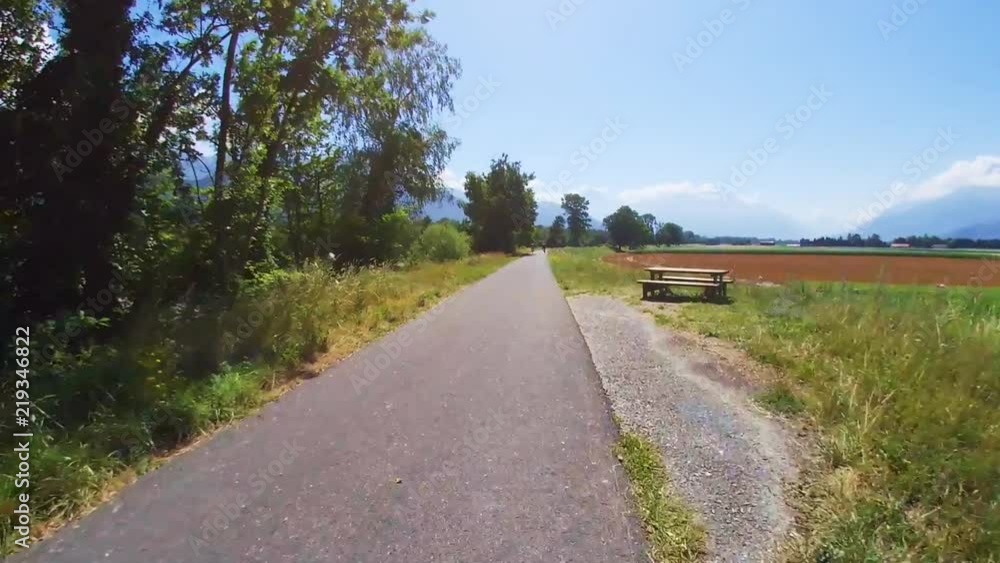 Cycling on a road at Switzerland mountains countryside Cycling on a road at Switzerland mountains countryside