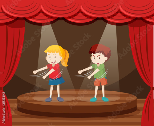 Two children dancing on stage