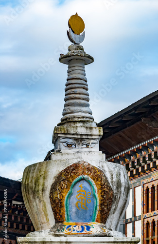 Stupa in Mongar - Bhutan. A stupa is a mound-like or hemispherical structure containing relics of Buddhist monks or nuns that is used as a place of meditation. photo