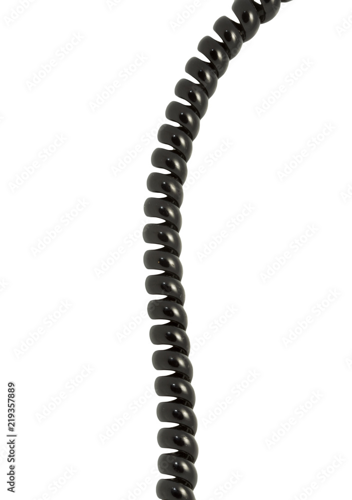 black spring cable on white background. Macro photography black spring cable on white background. Macro photography