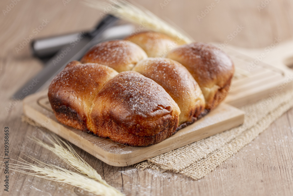 Brazilian Homemade bread on top of a wooden countertop Brazilian Homemade bread on top of a wooden countertop