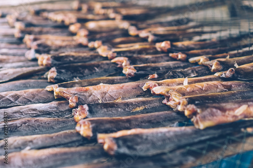 Food preservation of fish make it dried by sun baht on grille.