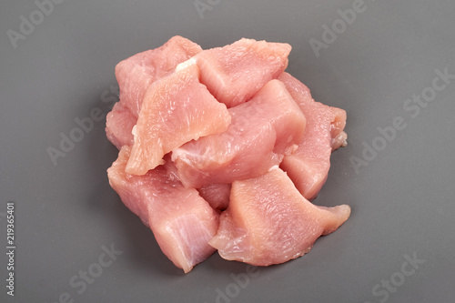 Raw turkey fillet pieces , isolated on gray background