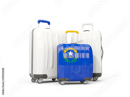 Luggage with flag of nevada. Three bags with united states local flags