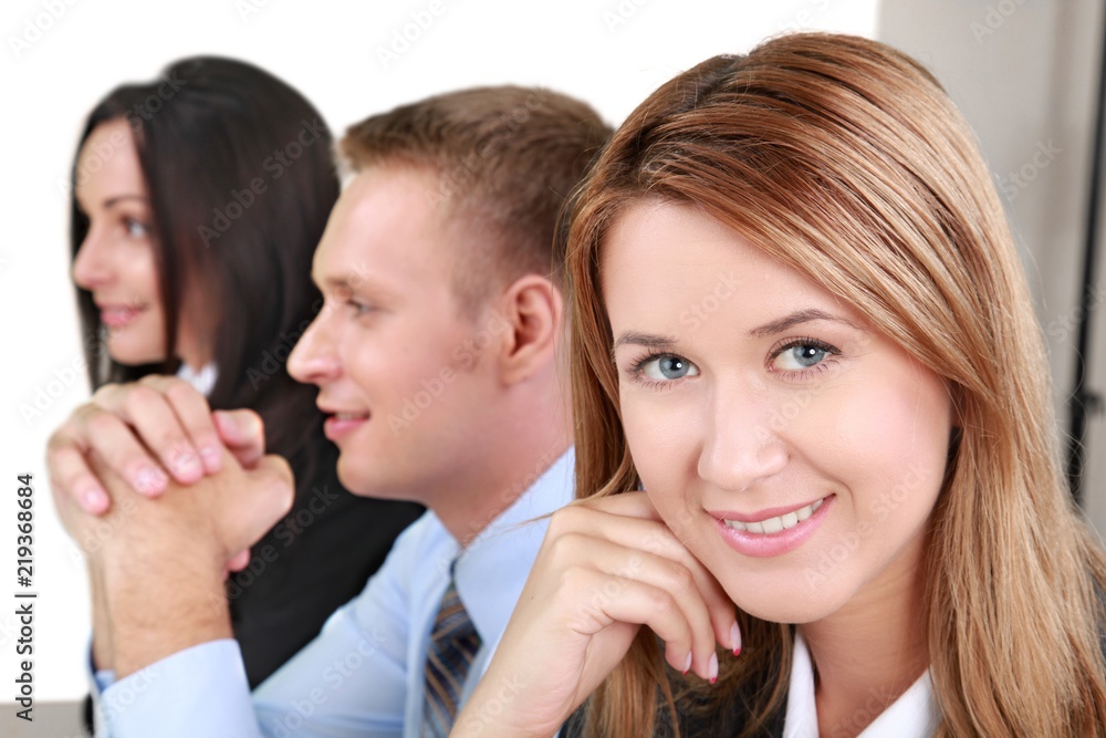 Young Woman in the Background of Co-Workers - Isolated Young Woman in the Background of Co-Workers - Isolated