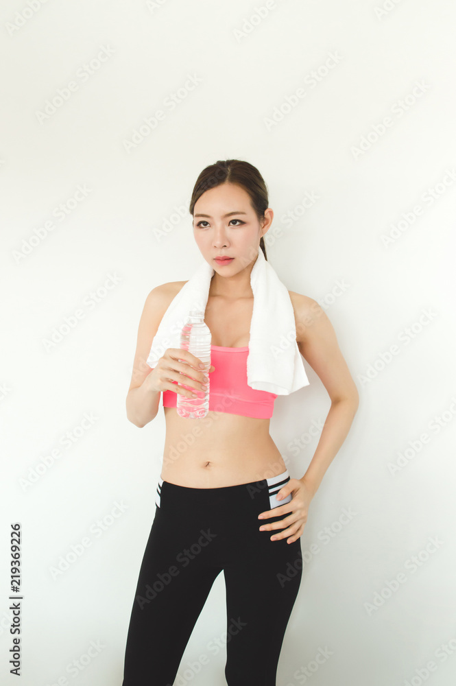Exercise concept. Athletes are tired of exercising. Beautiful girl drinking water after exercise. Exercise concept. Athletes are tired of exercising. Beautiful girl drinking water after exercise.