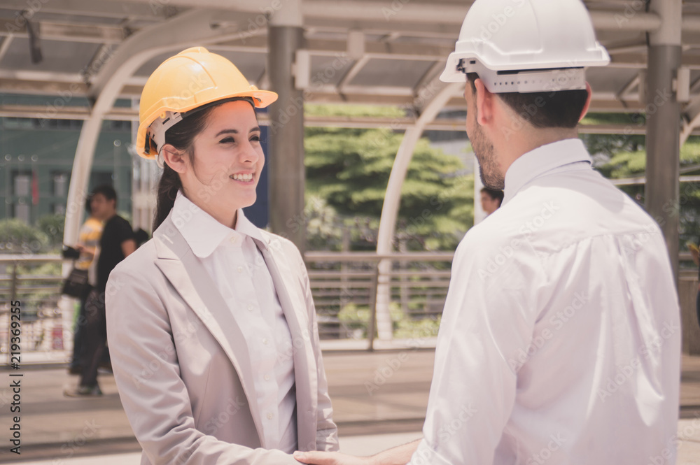 Business concept. Businessmen are working on engineering. Businessmen are planning work outside the building. Business concept. Businessmen are working on engineering. Businessmen are planning work outside the building.
