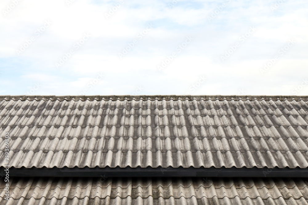 roof wavy tile, roofing tile old, white or grey roofing tile old on sky background