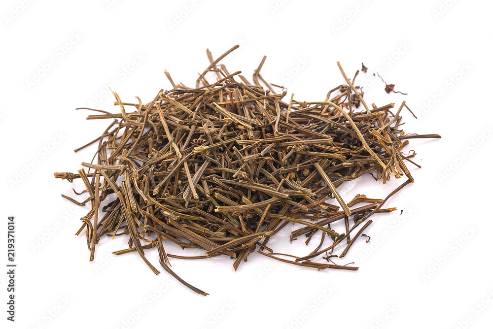 Fototapeta premium Black dry tea leaves isolated on white background