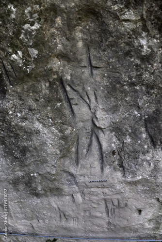 Ancient Germanic runes on the wall of the cave