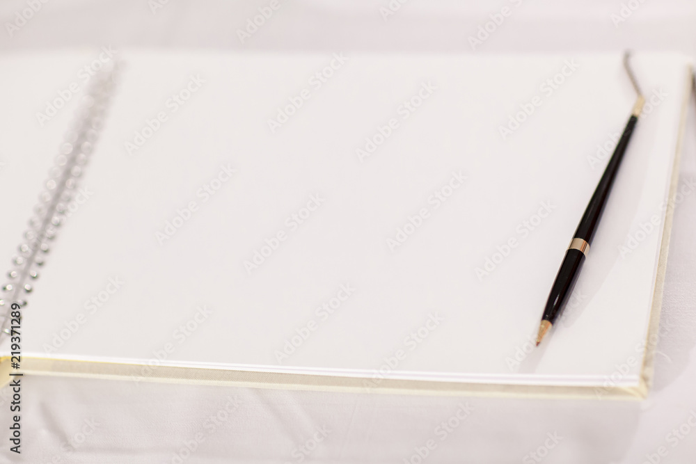 Wedding album, blank page, guest list, to do list.still life photography concept by memory and notebook.Notepad book.Notebook and asters on canvas background.soft and blur style for background. Wedding album, blank page, guest list, to do list.still life photography concept by memory and notebook.Notepad book.Notebook and asters on canvas background.soft and blur style for background.