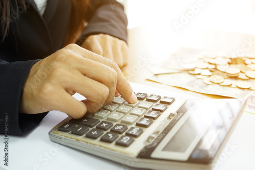 Fototapet Calculate to spend money and salary. (Thai and Dollar)