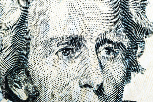 Close up view Portrait of Andrew Jackson on the one twenty dollar bill. Background of the money. 20 dollar bill with Andrew Jackson eyes macro shot. Money background. Face portrait photo