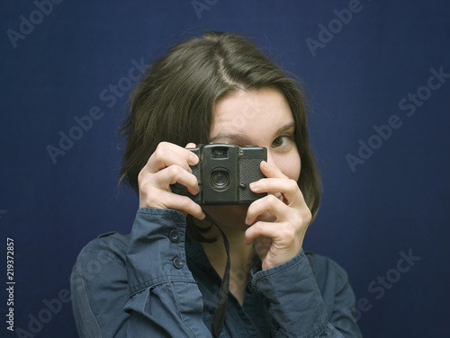 Woman With Retro Photocamera