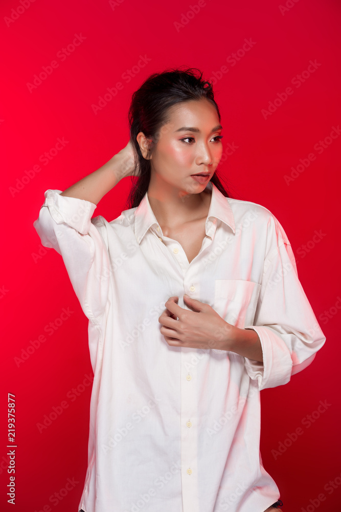 Asian tanned skin woman with strong color red lips Asian tanned skin woman with strong color red lips