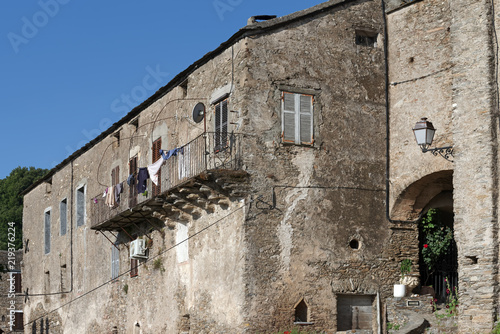 Fototapeta Naklejka Na Ścianę i Meble -  Facade of old building in Costa verde mountain.Corsica