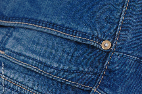 part of the blue denim pants with pockets and rivets, close-up © warloka79