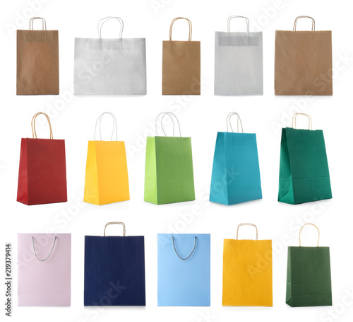 Set with shopping bags on white background photo