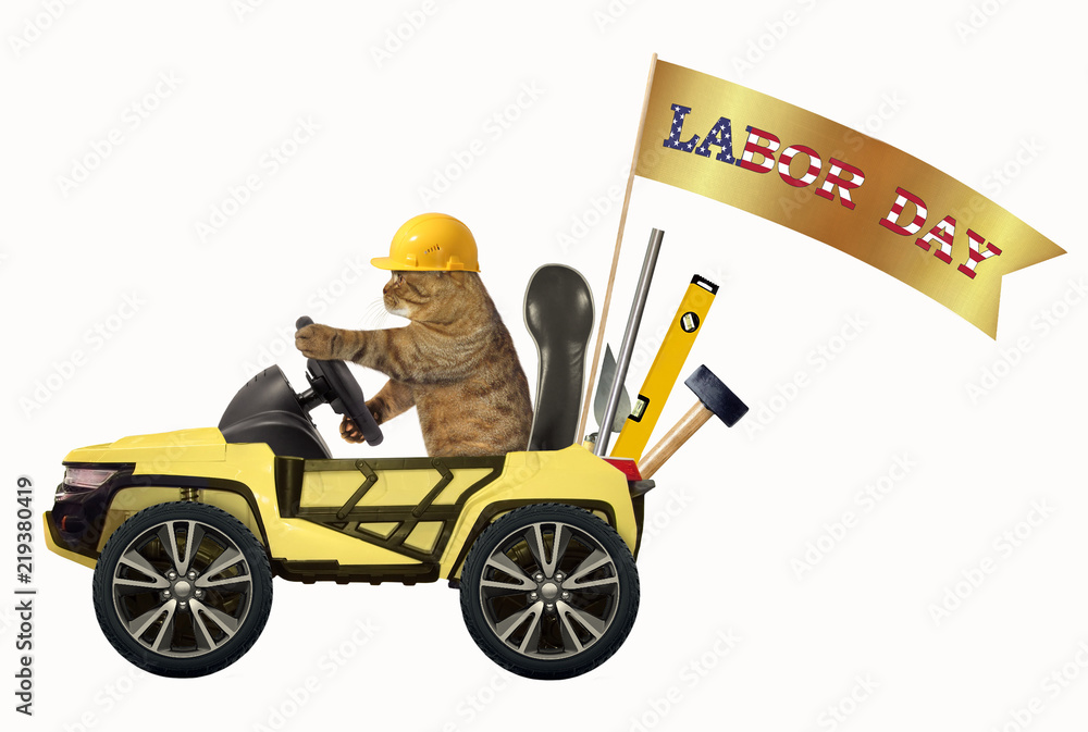 Naklejka premium The cat in a helmet is driving a yellow suv with a banner 