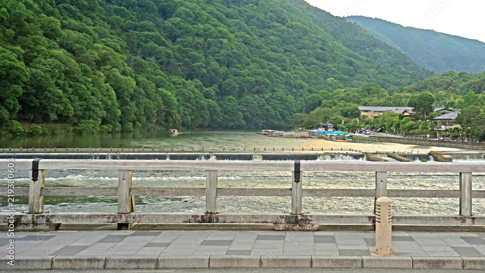 Traditional bridge, footpath, mountain, bridge, rapid river in Japan Kyoto