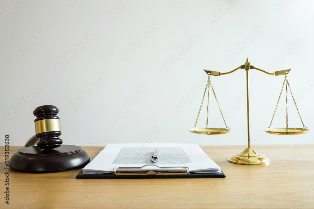 Scales of justice and Gavel on sounding block, object and law book to working with judge agreement in Courtroom, Justice and Law concept Scales of justice and Gavel on sounding block, object and law book to working with judge agreement in Courtroom, Justice and Law concept
