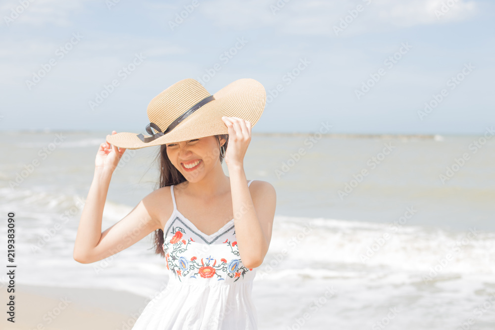 Beautiful girl laughing happily on a sunny day, Hua Hin, Thailand