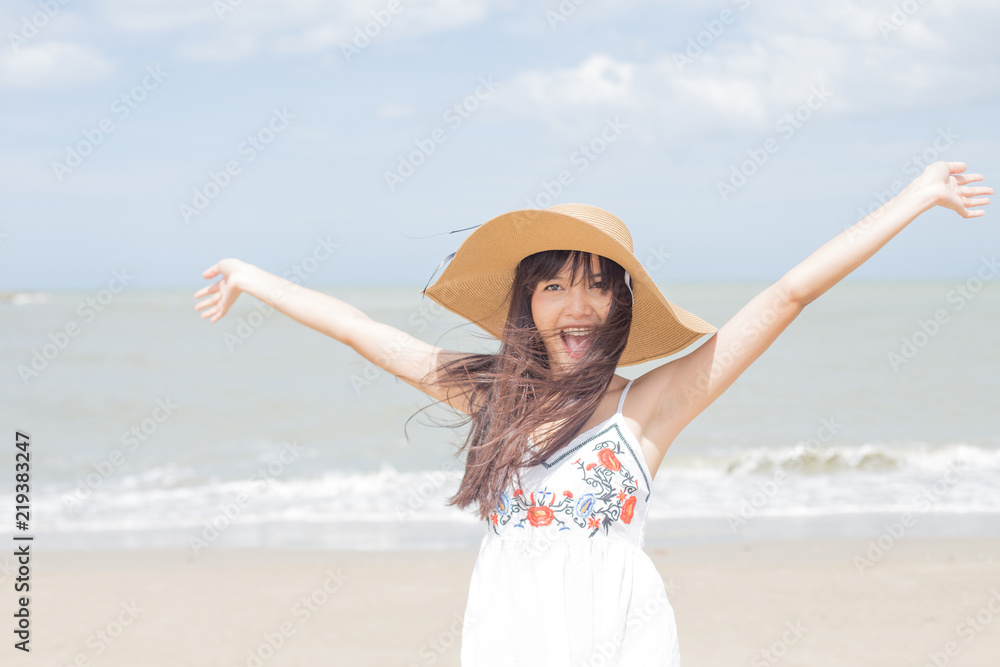 Beautiful girl laughing happily on a sunny day, Hua Hin, Thailand