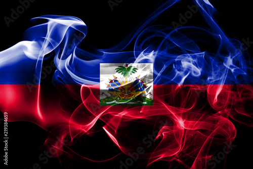 National flag of Haiti made from colored smoke isolated on black background photo