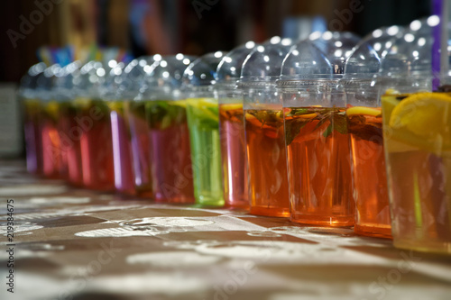 Beverage colorful drinks on the street market, chilled fruit drinks with ice in Asia.