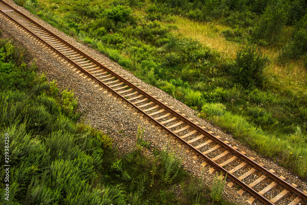 Aerial view of straight railroad tracks through farmland Aerial view of straight railroad tracks through farmland