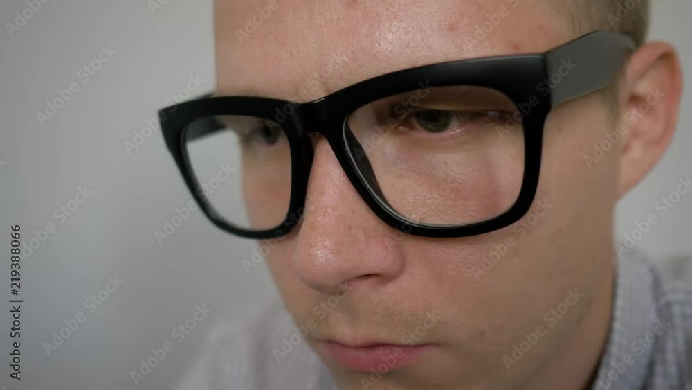 close-up eyes. The man with glasses thinks. close-up eyes. The man with glasses thinks.