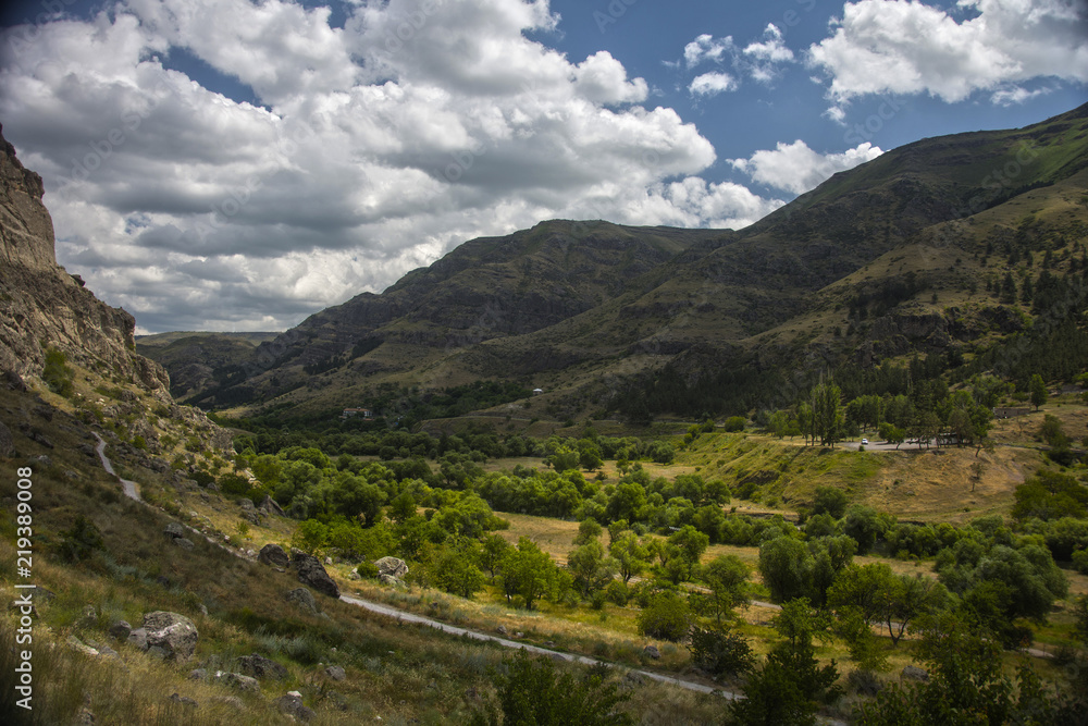 The mountains valley lighted by sun The mountains valley lighted by sun