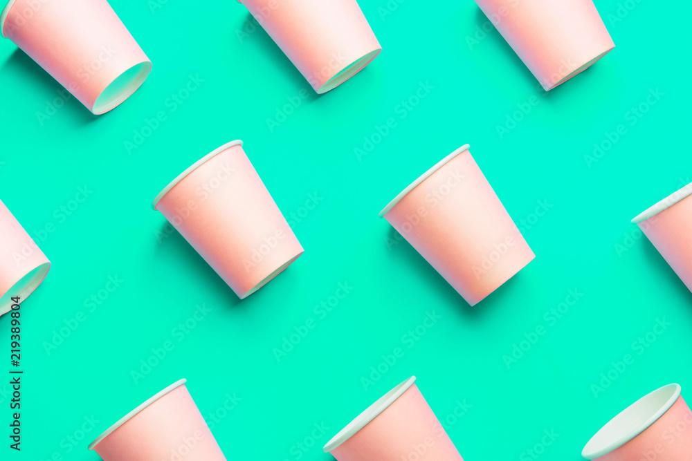 Pattern from Pink Paper Drinking Cups Arranged Diagonally on Light Green Turquoise Backgrounds. Birthday Party Celebration Abstract Fashion Baby Shower Concept. Pastel Colors. Minimalist Style Pattern from Pink Paper Drinking Cups Arranged Diagonally on Light Green Turquoise Backgrounds. Birthday Party Celebration Abstract Fashion Baby Shower Concept. Pastel Colors. Minimalist Style