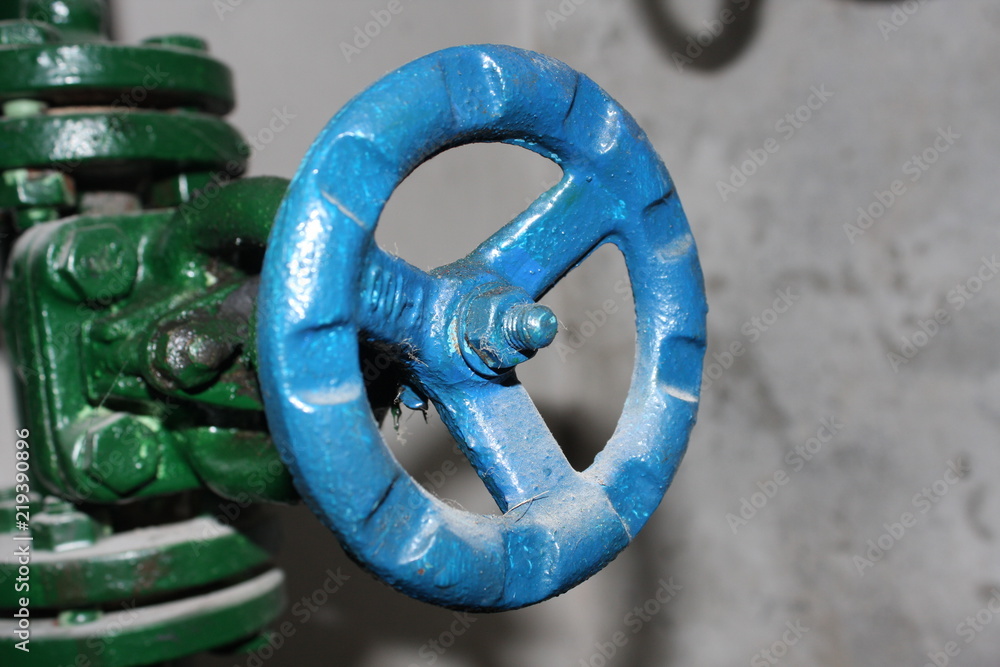 Close up of manual operate blue metal ball valve and pipes industrial equipment Close up of manual operate blue metal ball valve and pipes industrial equipment
