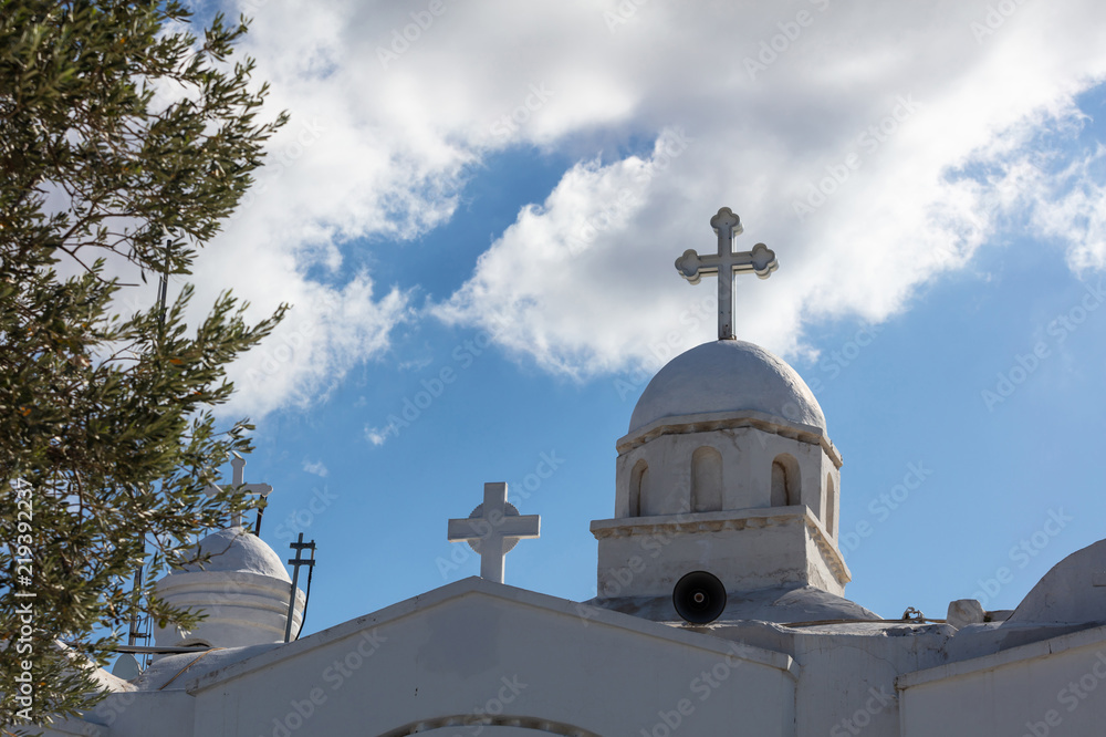 White dome church in Athens Greece, on a blue sky background