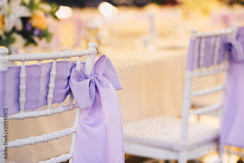 Chair decoration with a ribbon for a special event/wedding 