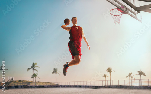 Streetball. Basketball player in action on sunset. © VIAR PRO studio