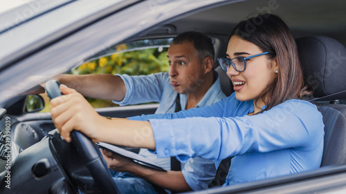Woman Driver - Car Accident, yells in fear or frustration. Student girl sitting scared in a car. incident happens. Car Crash Accident with a Scared Driver and a instructor
