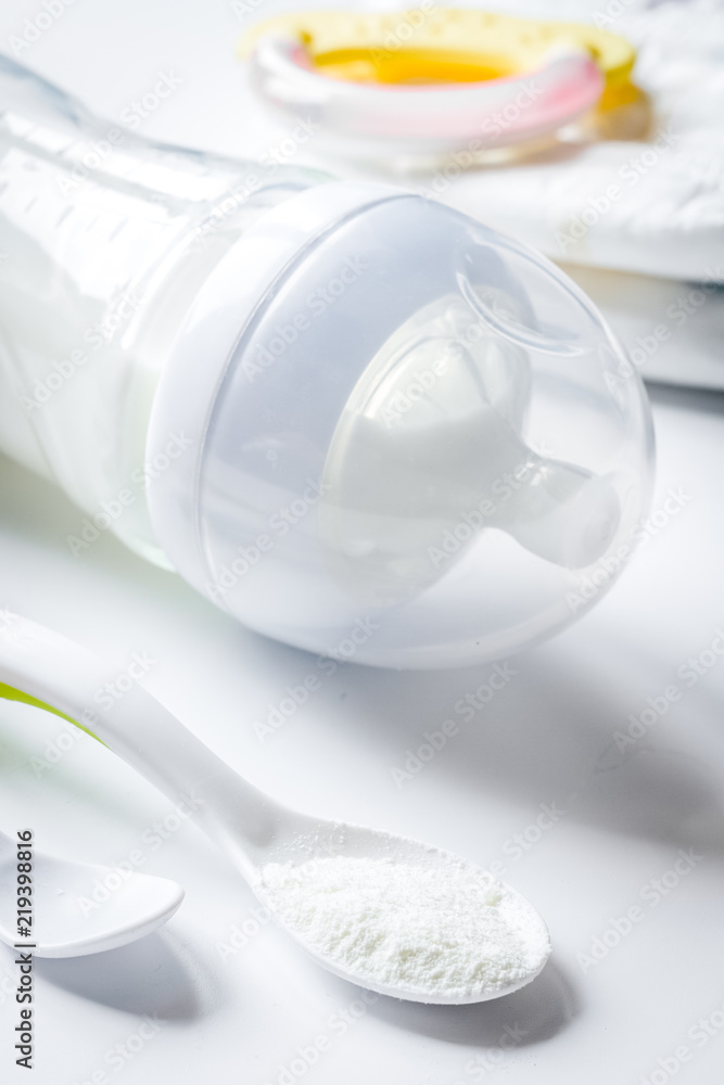 Fototapeta premium preparation of mixture baby feeding on white background