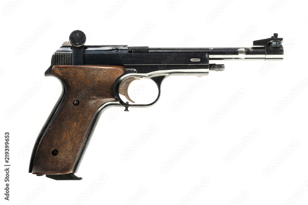 isolated used old sports pistol on a white background