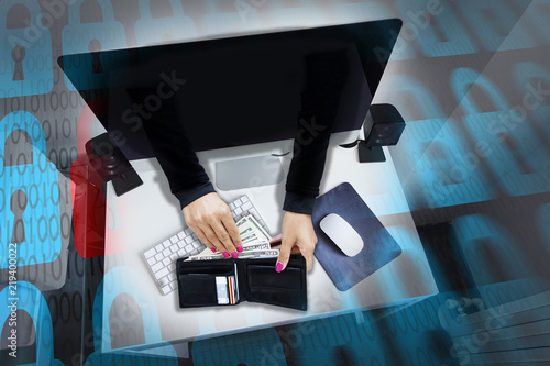 Foto Cyber attack or online fraud with hacker’s hands stealing money and credit cards