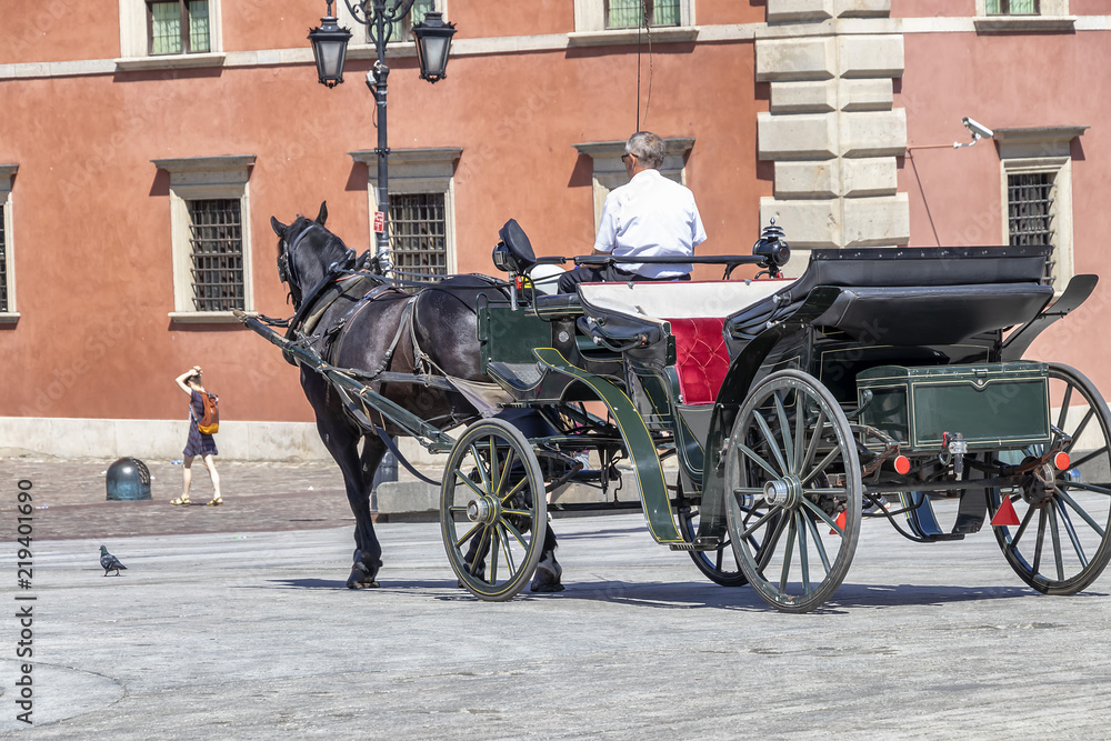 Horse carriage at Castle Square in the Old Town of Warsaw, Poland