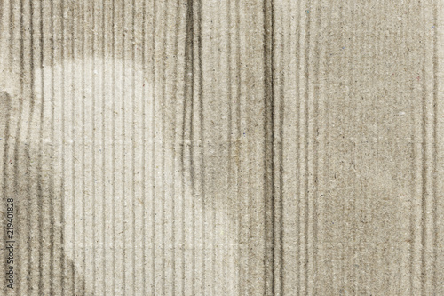 Old corrugated cardboard sheet with creases, texture background