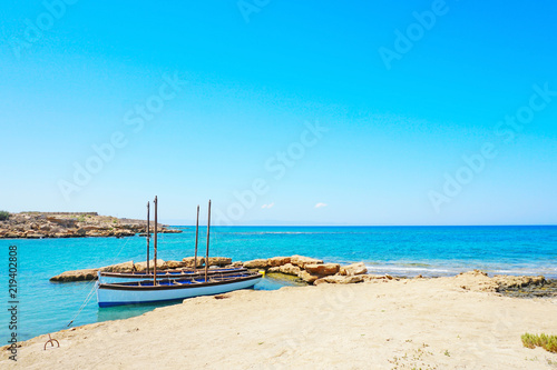Beautiful Cypriot landscape by the sea with fishing boats in bright sunny day