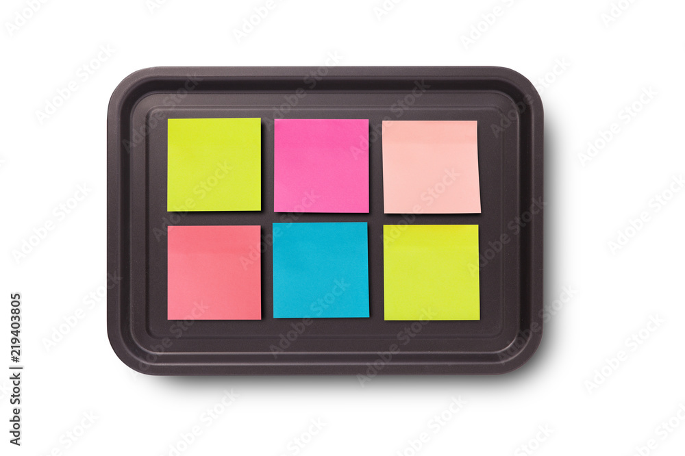 collection of colorful post it paper note on baking tray, on white background collection of colorful post it paper note on baking tray, on white background